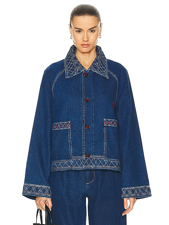 Denim jacket featuring Sashiko stitching details in contrasting thread inspired by Japanese craftsmanship.