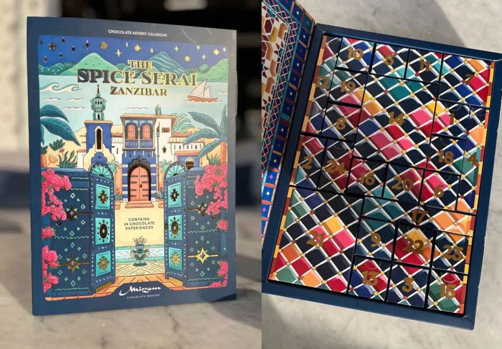 Mirzam Spice Serai Zanzibar advent calendar with vibrant architectural illustration and patterned drawers, showing cultural Christmas 2025 graphic codes.