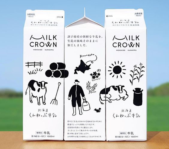 Illustrated milk packaging using minimal graphics and storytelling to represent graphic design trends 2026 through cultural clarity.
