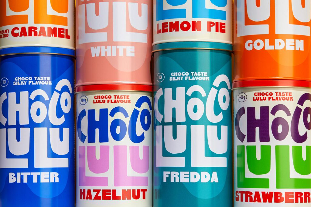 Playful chocolate powder packaging using bold colour and expressive typography to reflect graphic design trends 2026 through joy and emotional connection.