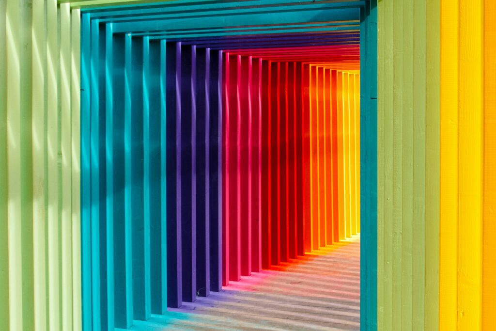 Layered corridor of coloured panels illustrating how cultural branding and packaging design relies on nuance, contrast and contextual perception across markets.