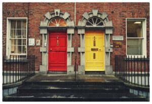 Red and yellow doors side by side symbolising choice when selecting a CPG packaging design agency