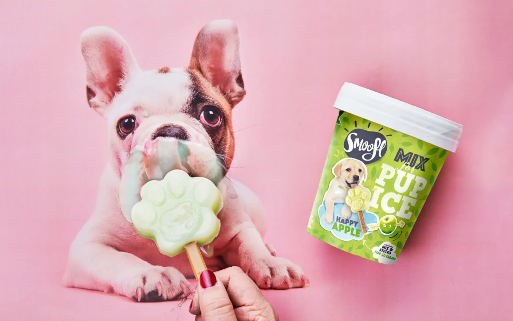 Dog eating ice cream treat showing playful indulgence in petcare trends