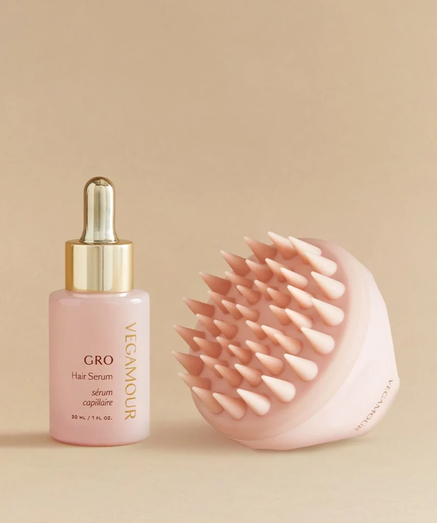Hair serum and scalp tool representing wellness in future of haircare