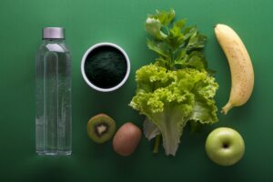 Fresh fruits, leafy greens and functional ingredients representing modern functional food and beverage trends.