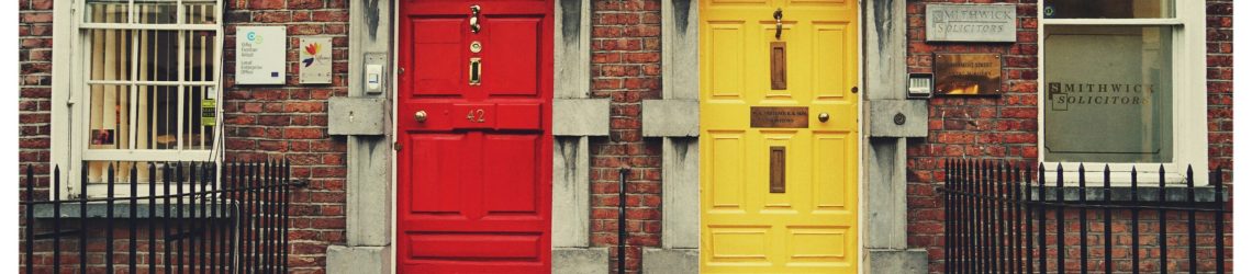 Red and yellow doors side by side symbolising choice when selecting a CPG packaging design agency